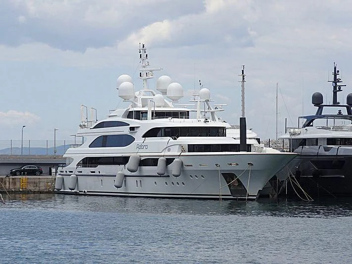 a couple of boats sit in a harbor aboard ADORA Yacht for Sale