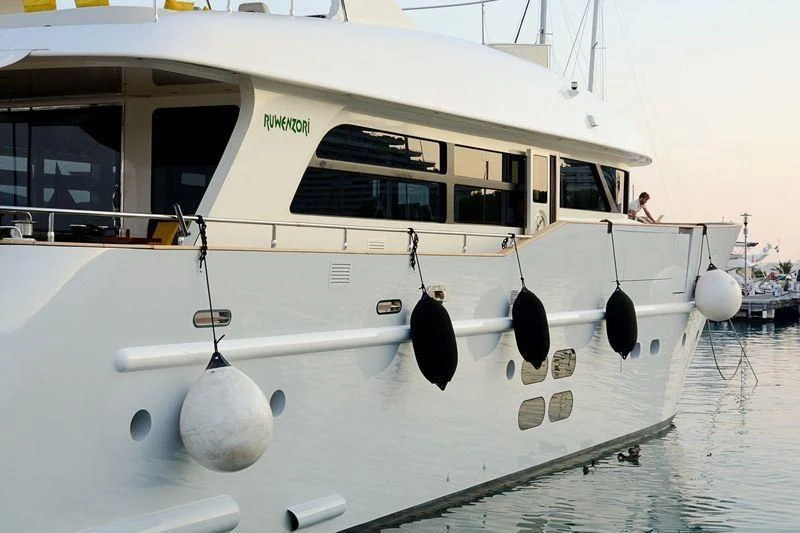 a boat docked in the water aboard MR GU Yacht for Sale
