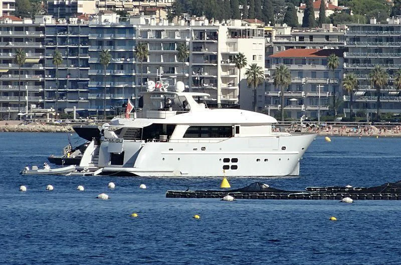 a white boat on the water aboard MR GU Yacht for Sale