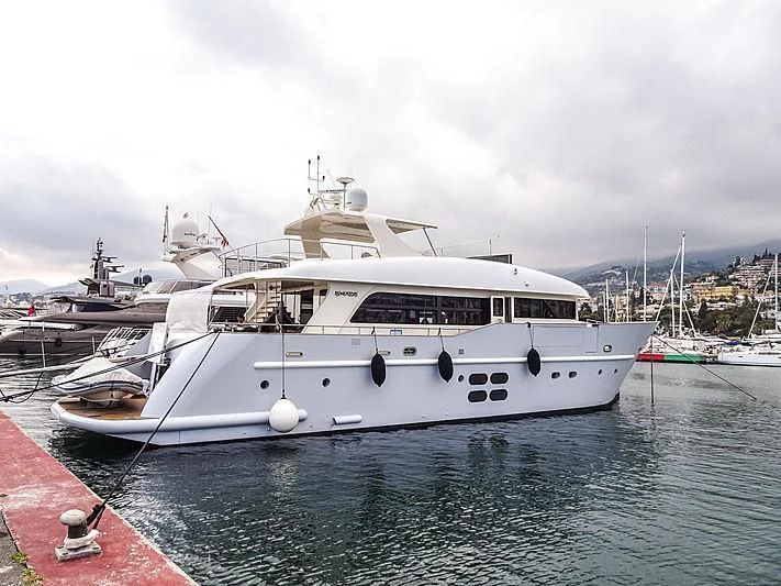 a white yacht in the water aboard MR GU Yacht for Sale