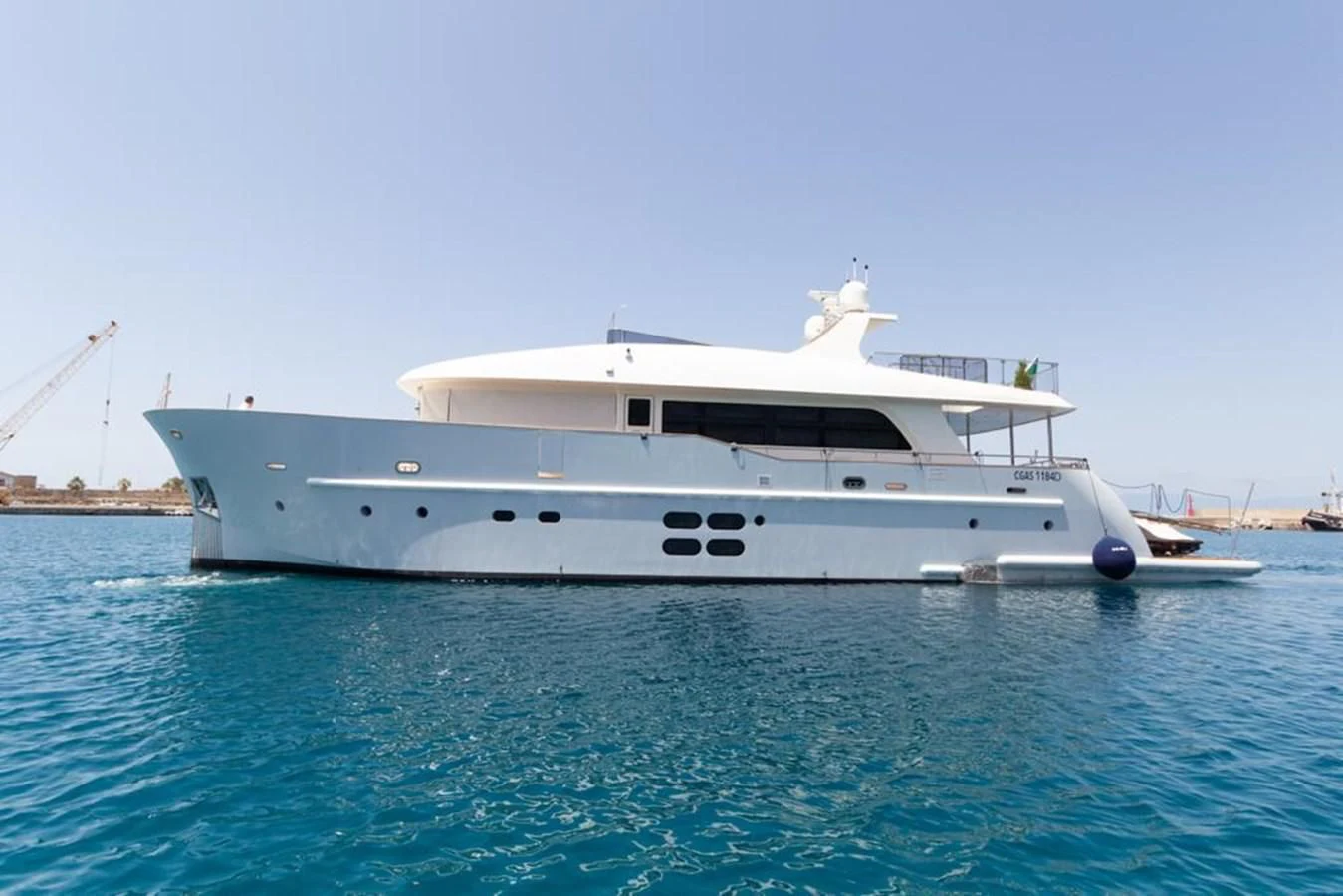 a white boat in the water aboard MR GU Yacht for Sale