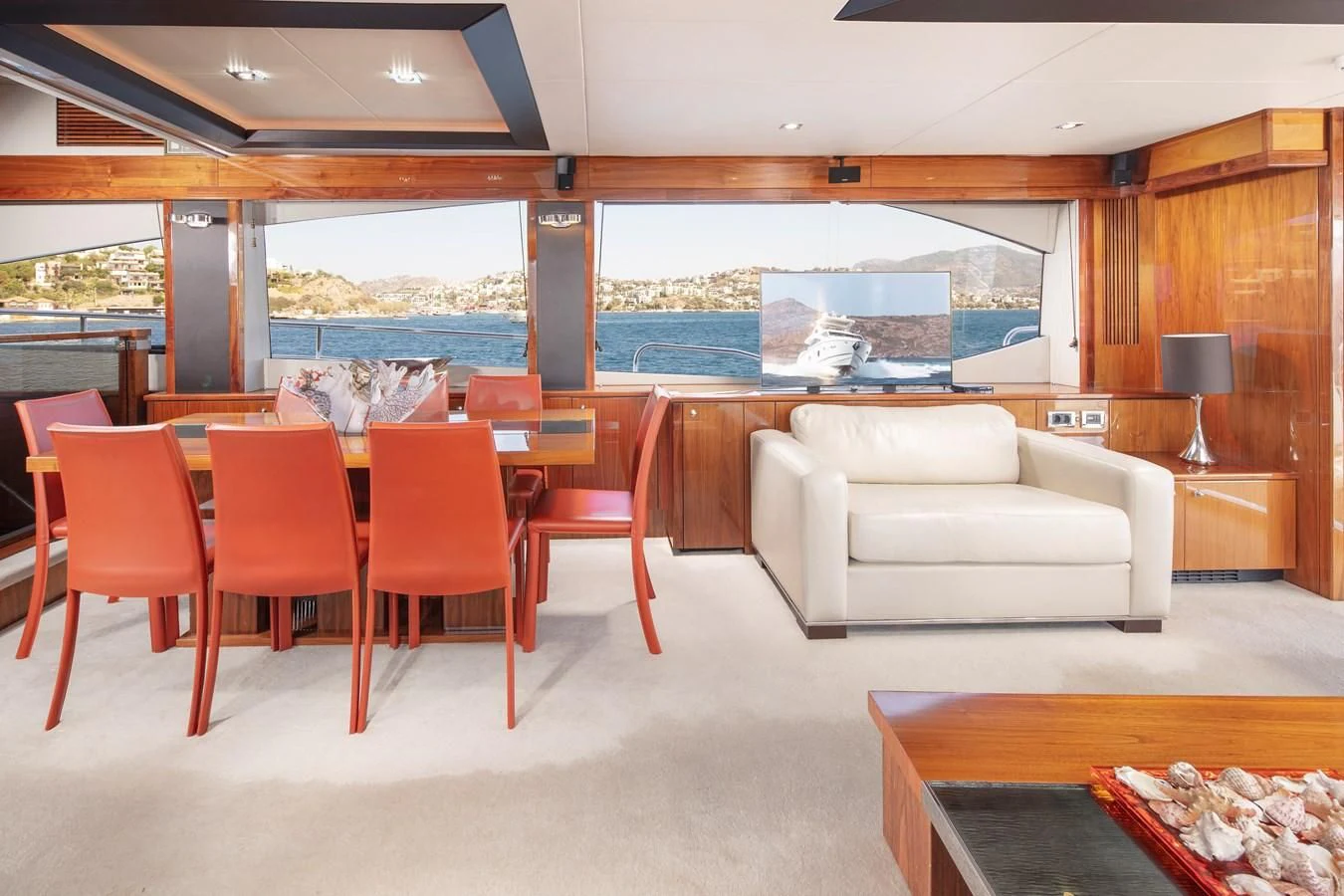 a room with a couch and a table and chairs aboard SSM Yacht for Sale