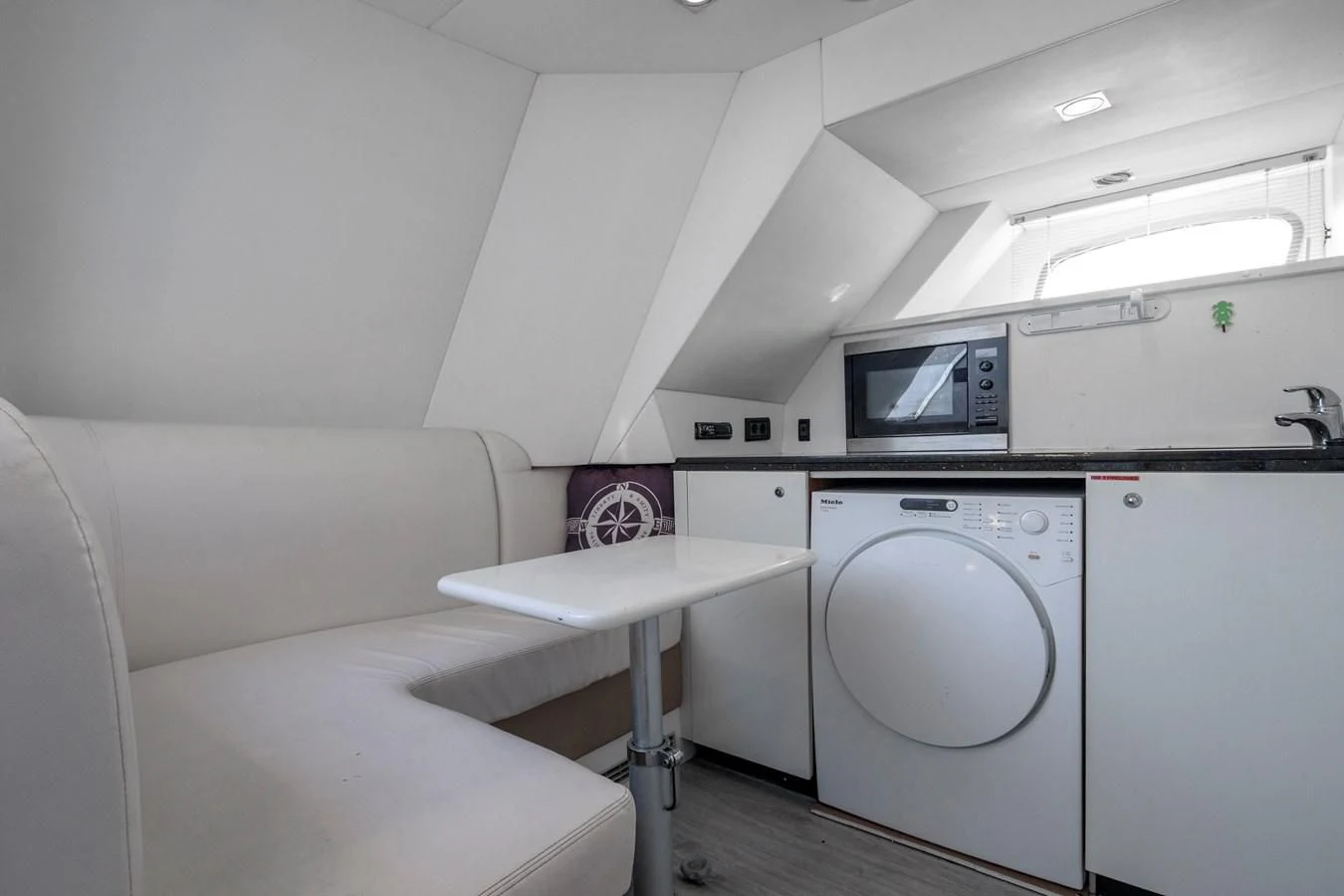 a room with a bed and a table aboard SSM Yacht for Sale