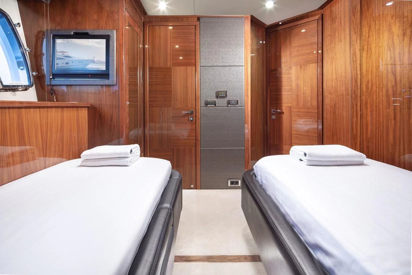 a room with a bed and a television aboard SSM Yacht for Sale