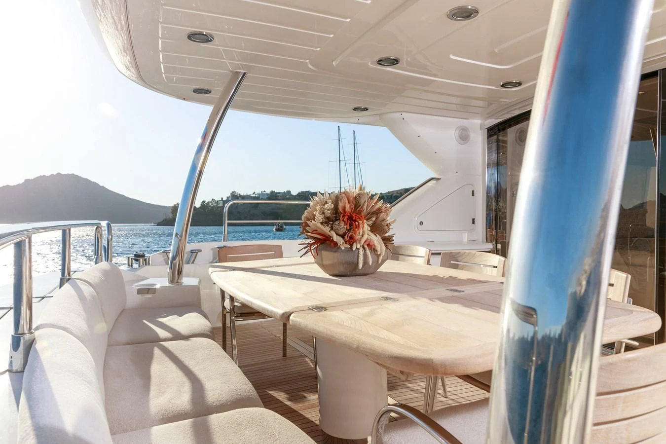 a boat with a table and chairs aboard SSM Yacht for Sale