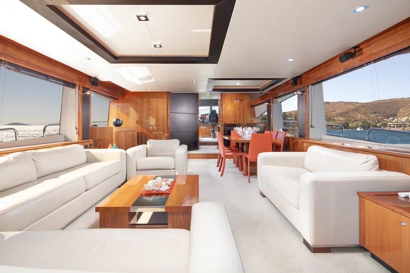 a living room with a large window aboard SSM Yacht for Sale