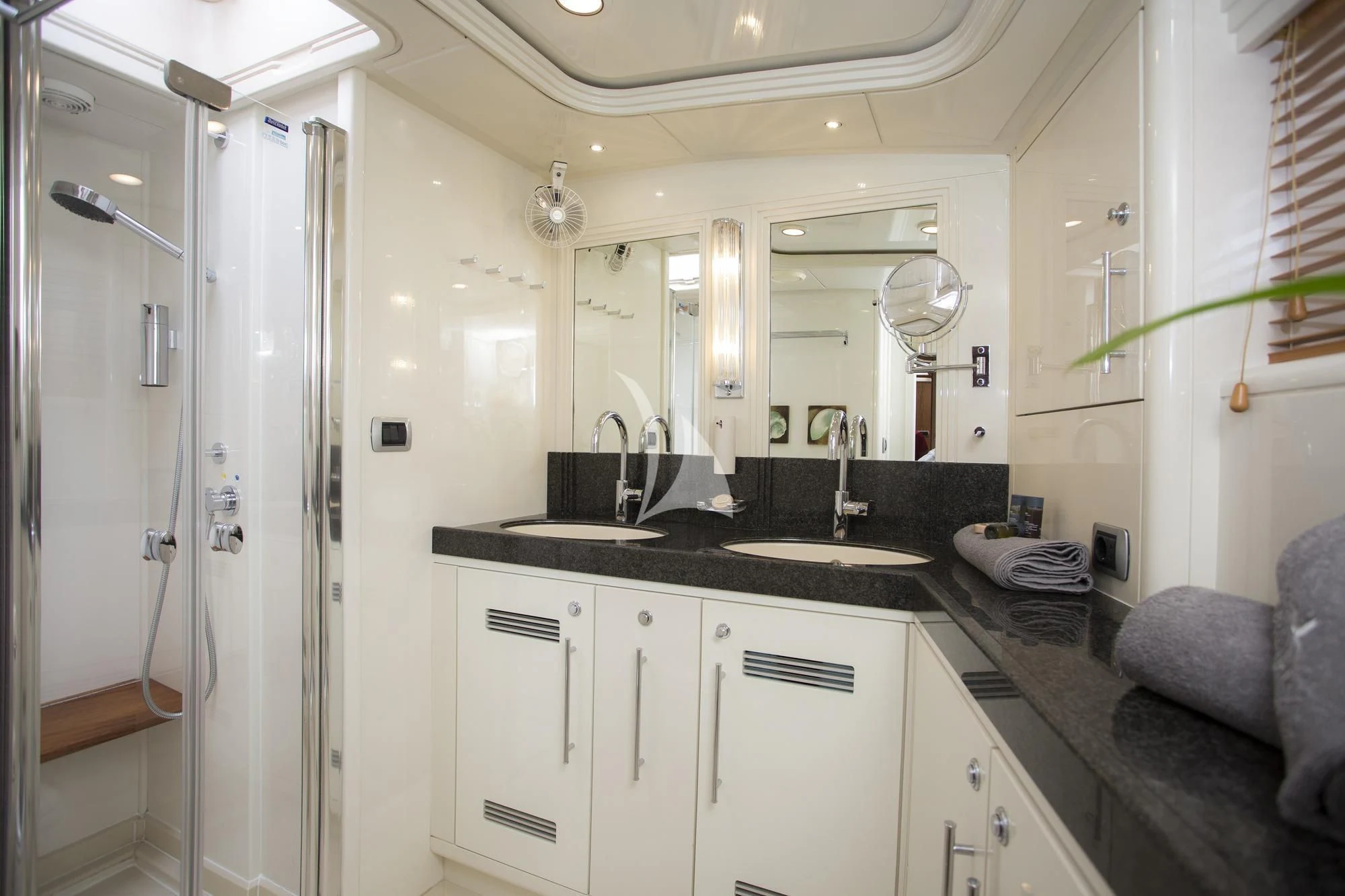 a bathroom with a sink and a mirror aboard SONGBIRD OF LONDON Yacht for Sale