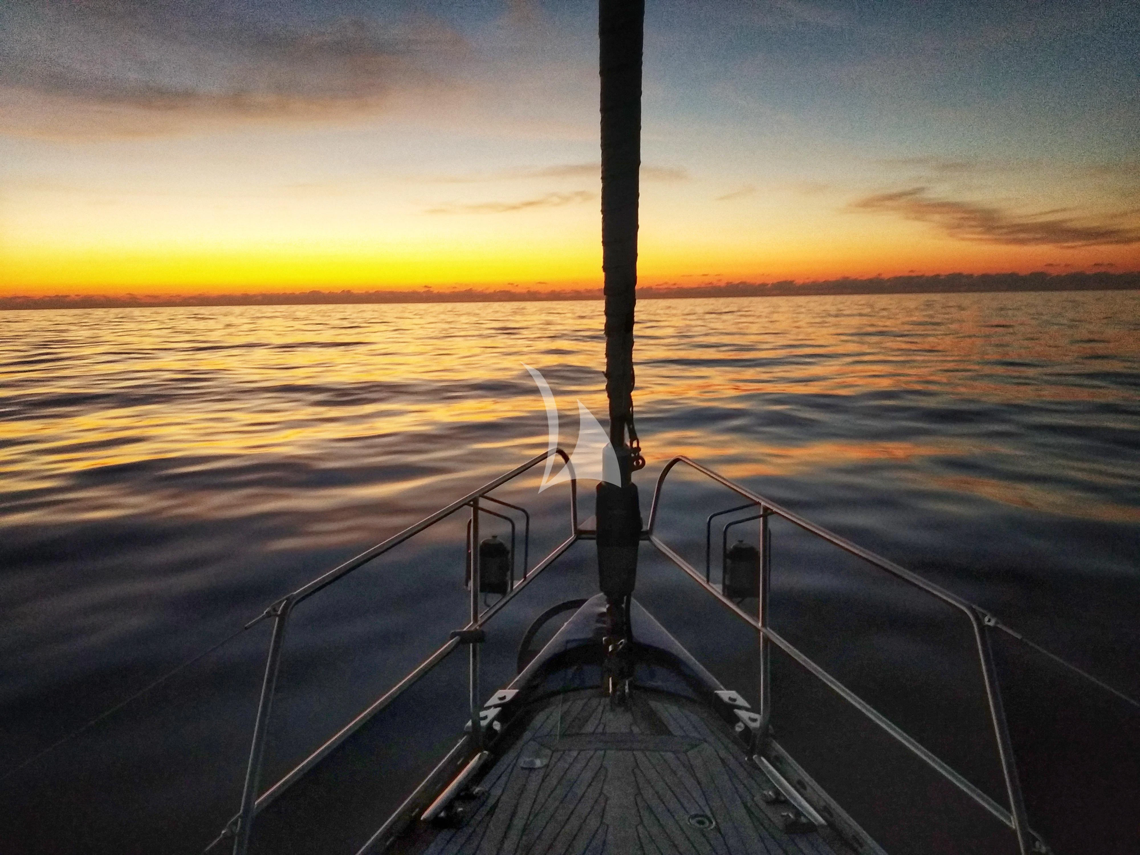 a large ship in the water aboard SONGBIRD OF LONDON Yacht for Sale