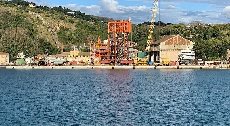 a large building next to a body of water aboard EUTOPIA Yacht for Sale