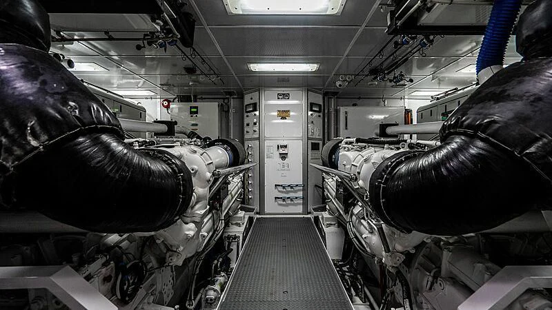 a person in a room with a machine aboard BLACK SWAN Yacht for Sale