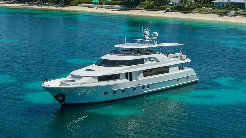 a white yacht on the water aboard BLACK SWAN Yacht for Sale