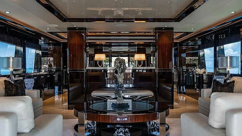 a room with a table and chairs aboard BLACK SWAN Yacht for Sale