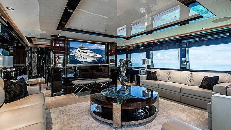 a living room with a large glass window aboard BLACK SWAN Yacht for Sale