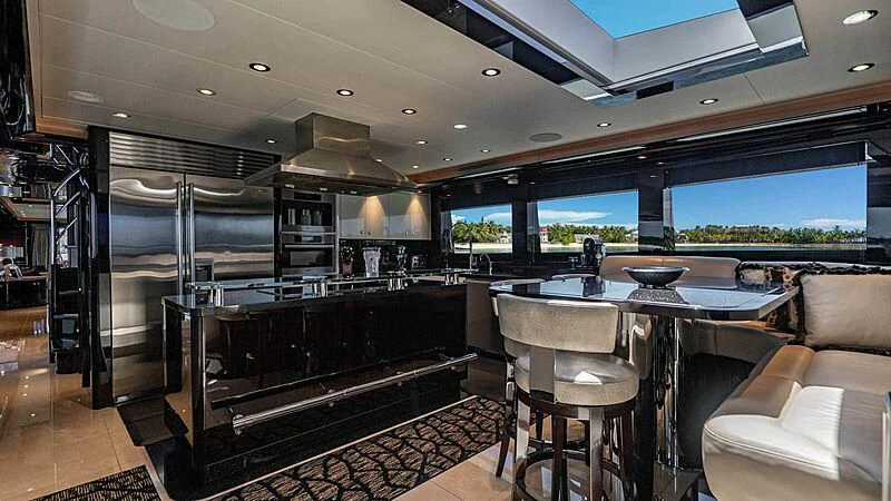 a kitchen and living room aboard BLACK SWAN Yacht for Sale