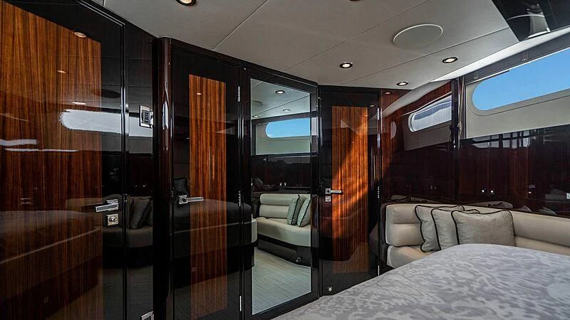 a room with a bed and a couch aboard BLACK SWAN Yacht for Sale