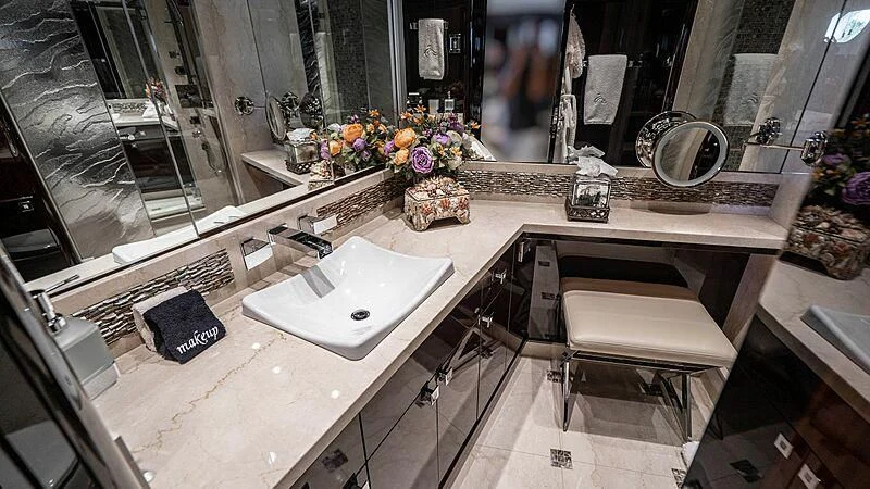 a bathroom with a large mirror aboard BLACK SWAN Yacht for Sale