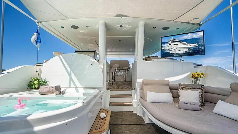 a room with a bed and a couch aboard BLACK SWAN Yacht for Sale