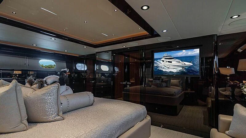 a living room with a large screen aboard BLACK SWAN Yacht for Sale