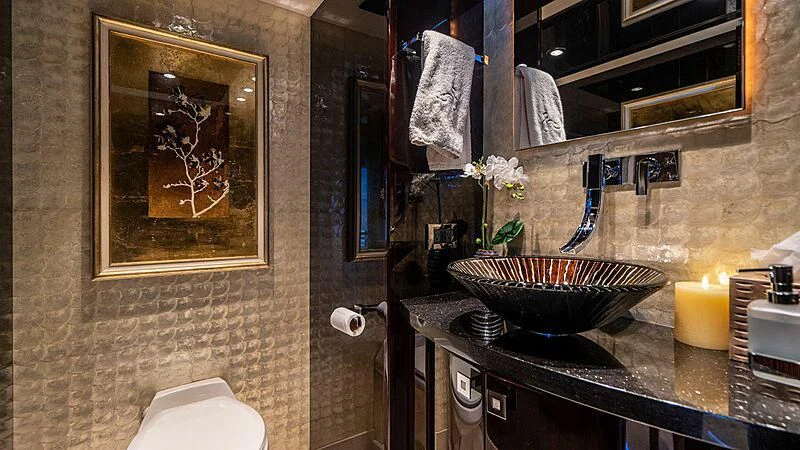a bathroom with a sink and mirror aboard BLACK SWAN Yacht for Sale