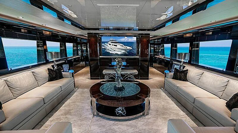 a living room with a large glass display aboard BLACK SWAN Yacht for Sale