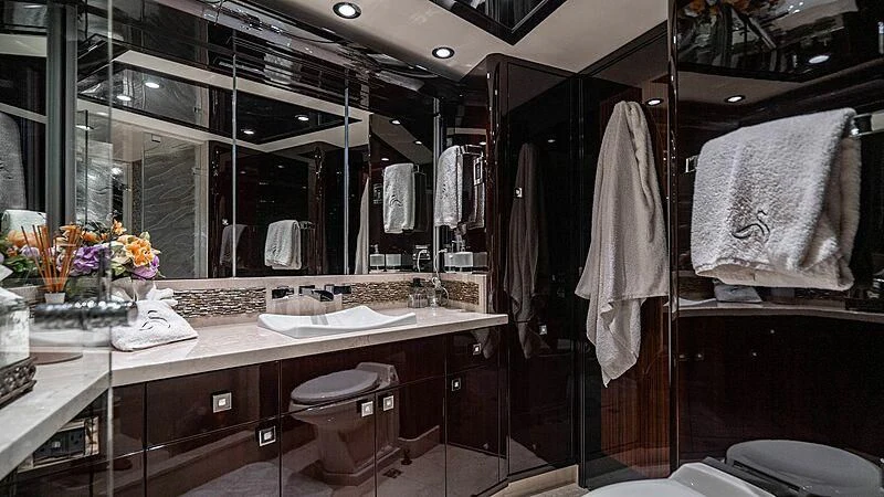 a bathroom with a large mirror aboard BLACK SWAN Yacht for Sale