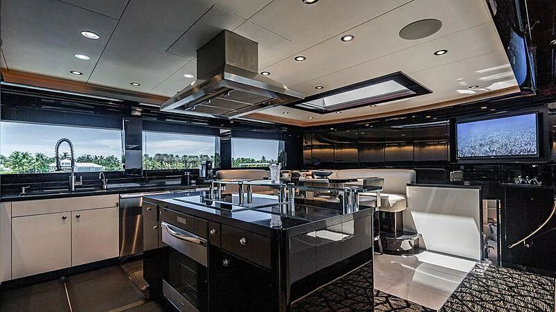 a kitchen with a large island aboard BLACK SWAN Yacht for Sale