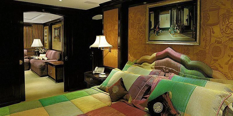 a bedroom with a bed and a mirror aboard ROCK & ROLL Yacht for Sale