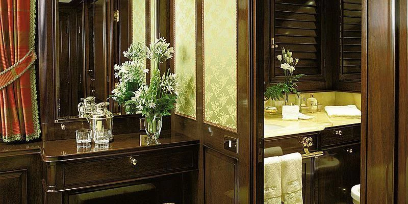 a bathroom with a vase of flowers aboard ROCK & ROLL Yacht for Sale