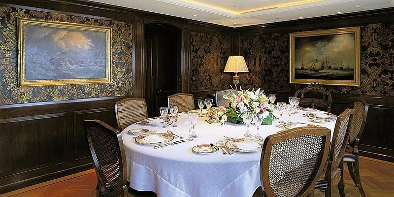 a dining table set for a formal dinner aboard ROCK & ROLL Yacht for Sale