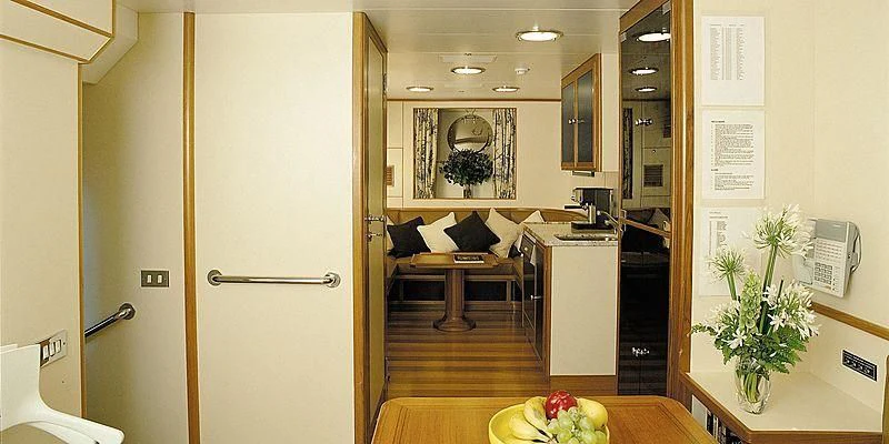 a room with a table and chairs aboard ROCK & ROLL Yacht for Sale