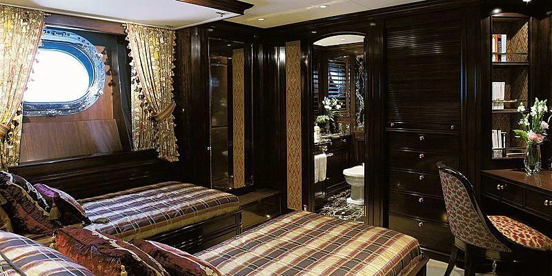 a room with a bed and a window aboard ROCK & ROLL Yacht for Sale