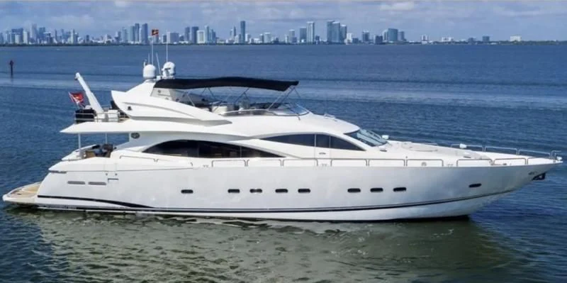 a white yacht in the water aboard SO WHAT WHO CARES Yacht for Sale