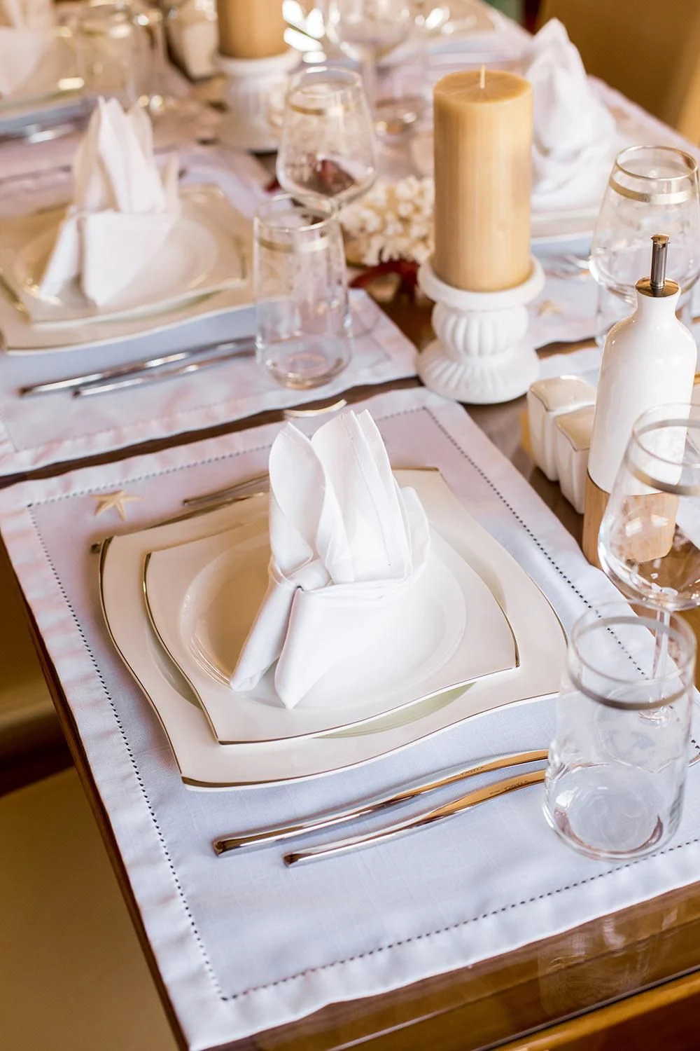 a table with glasses and plates aboard REBECCA V Yacht for Sale