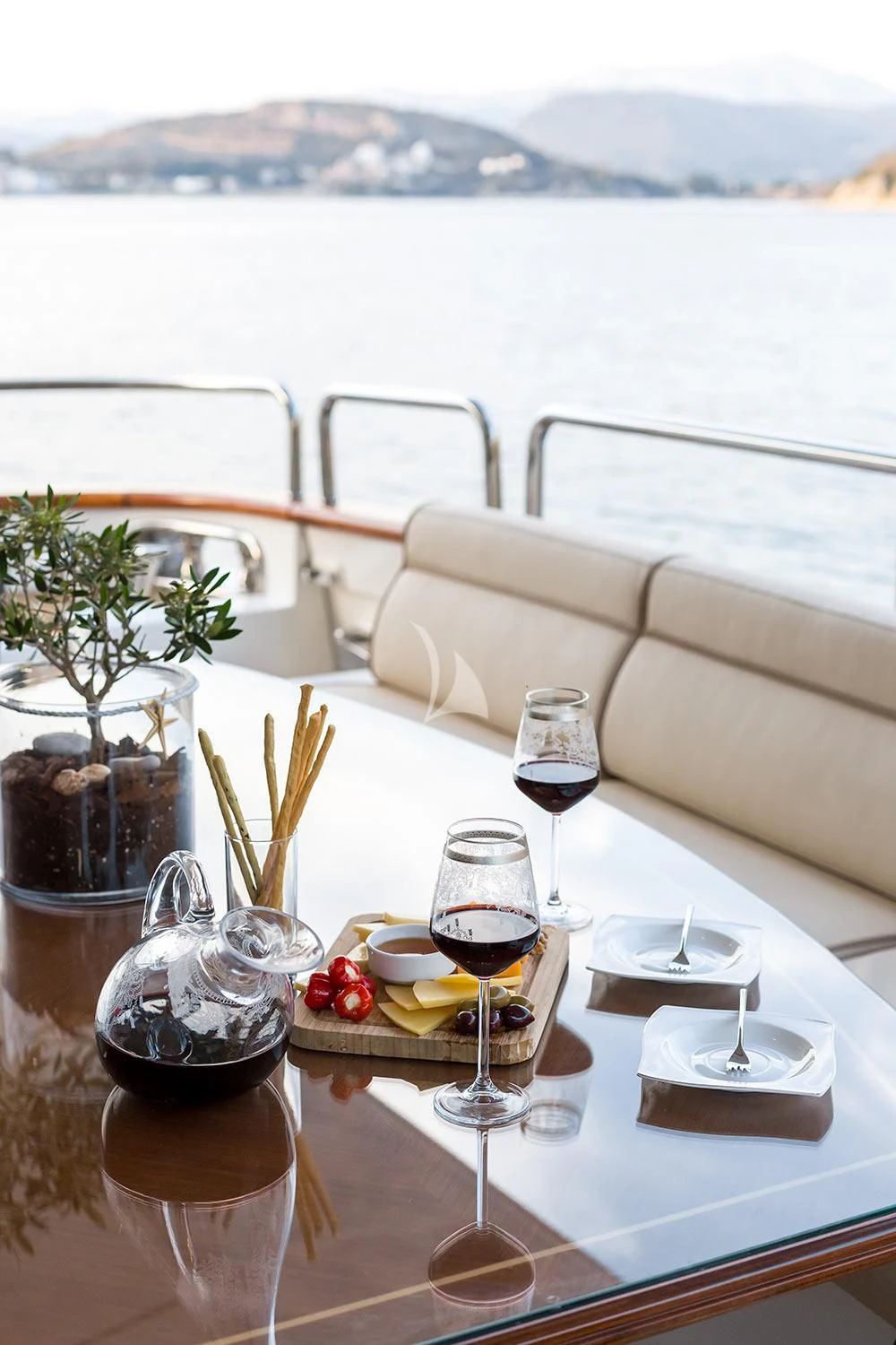 a table with food and wine glasses on it aboard REBECCA V Yacht for Sale