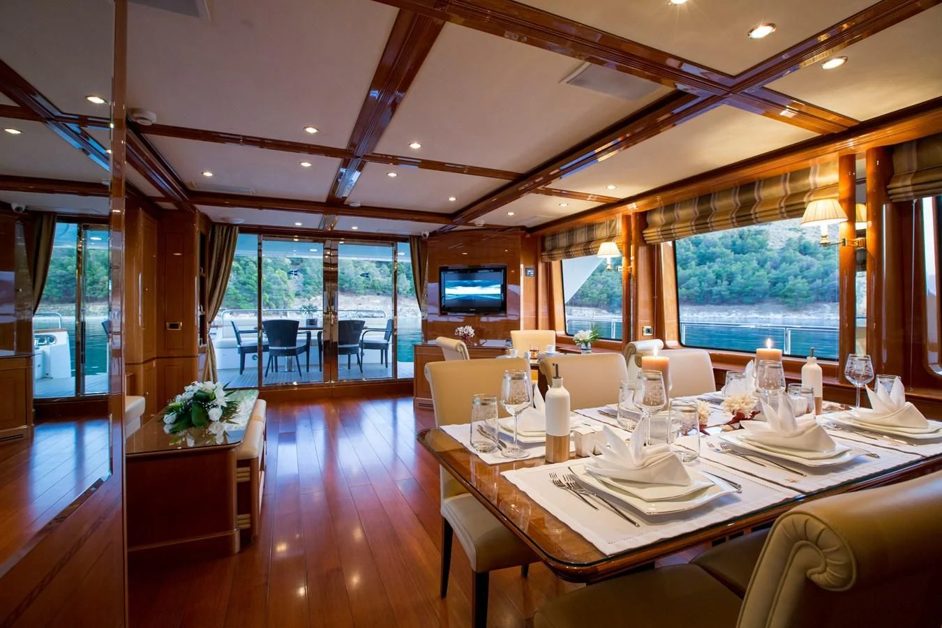 a room with a table and chairs aboard REBECCA V Yacht for Sale