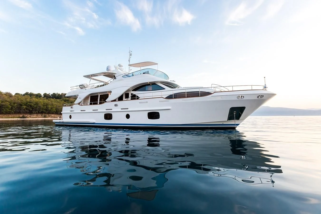 a white yacht on the water aboard REBECCA V Yacht for Sale
