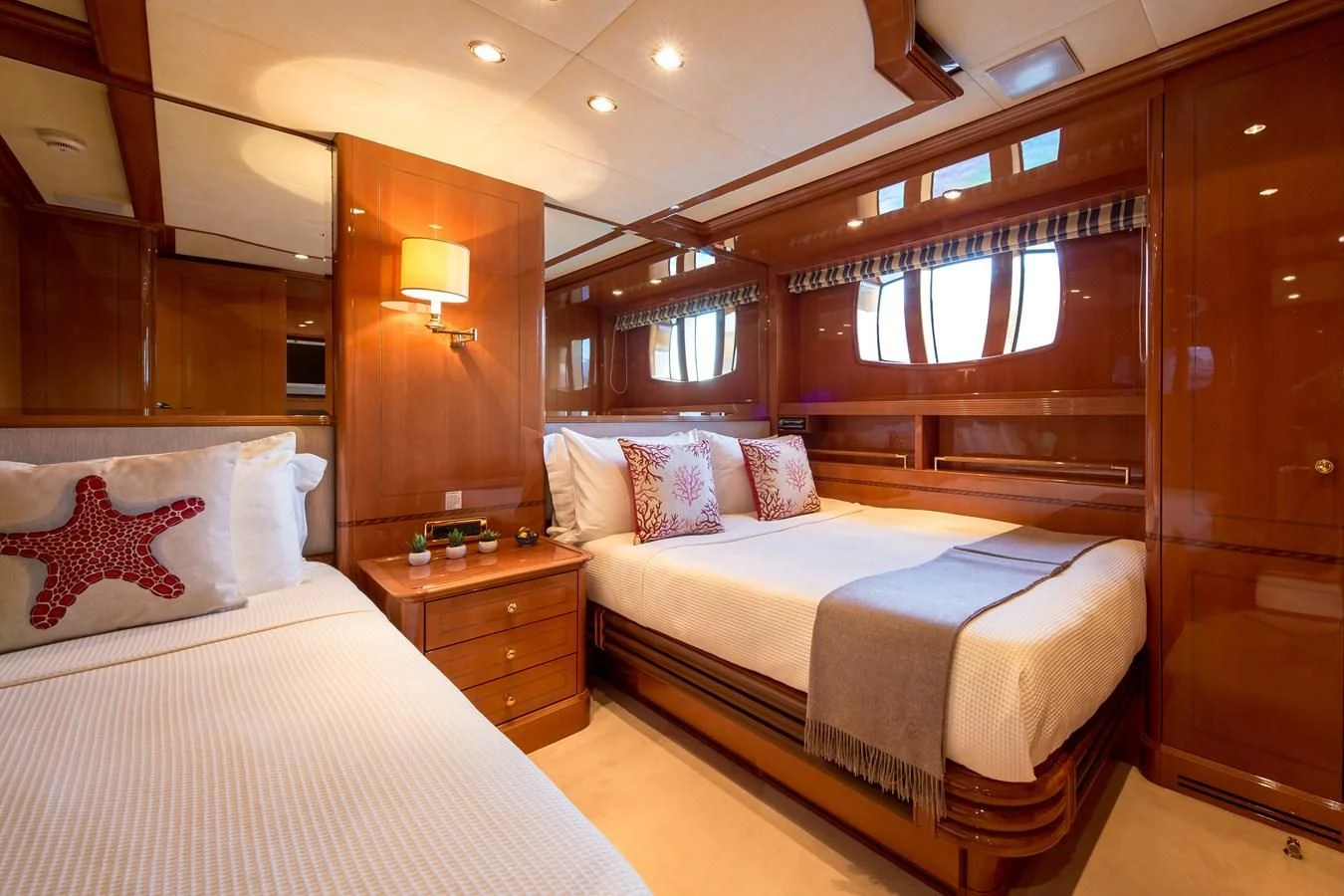 a couple of beds in a hotel room aboard REBECCA V Yacht for Sale