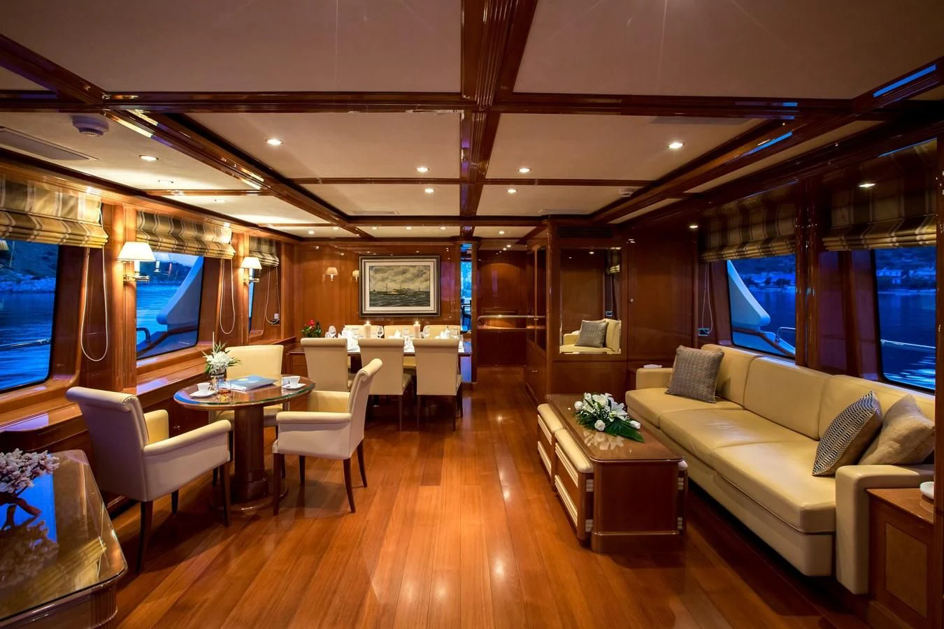 a living room with a wood floor aboard REBECCA V Yacht for Sale