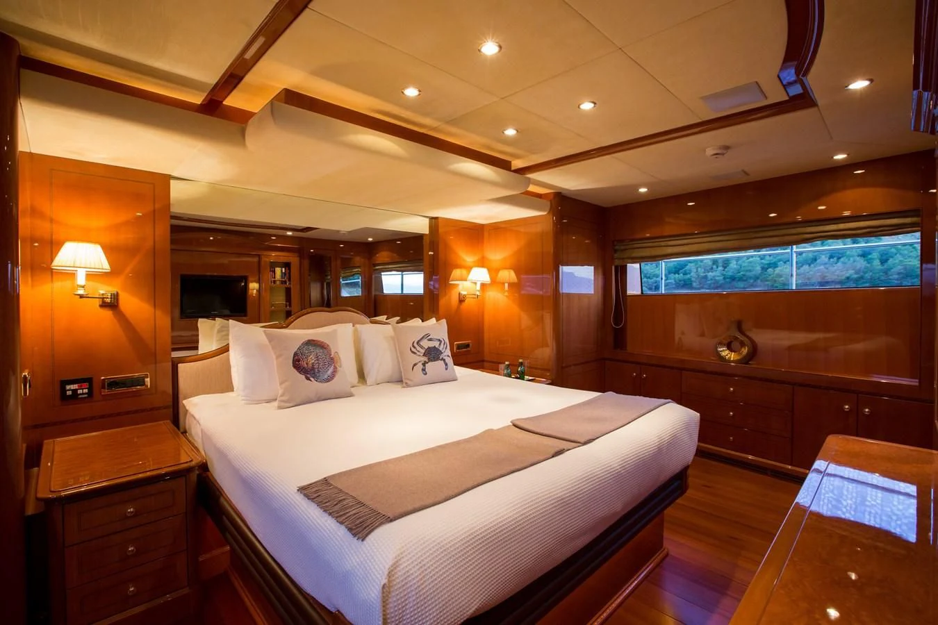 a large bedroom with a large bed aboard REBECCA V Yacht for Sale