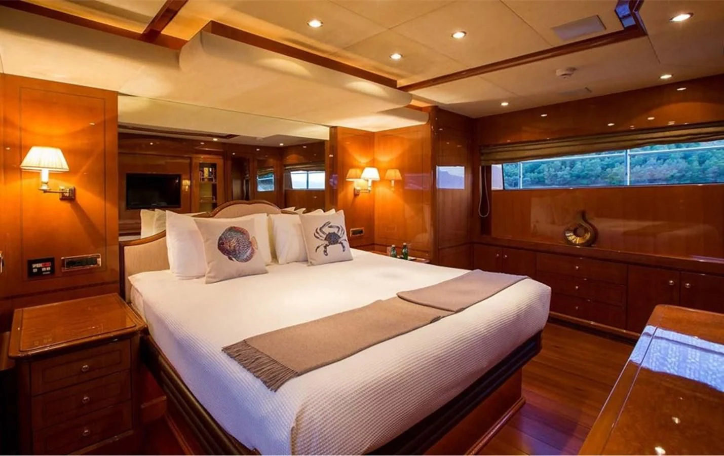 a large bedroom with a large bed aboard REBECCA V Yacht for Sale