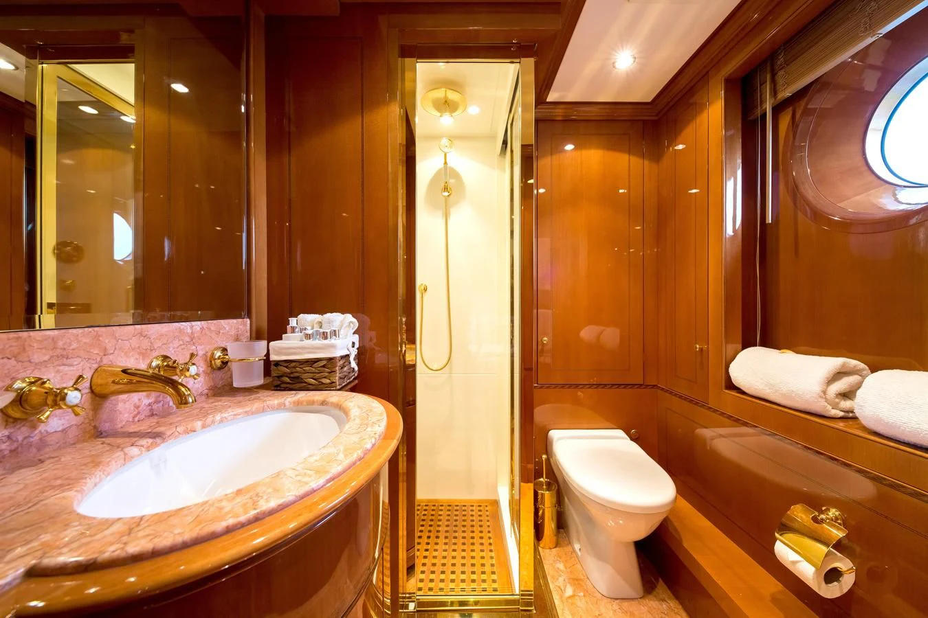 a bathroom with a toilet and sink aboard REBECCA V Yacht for Sale