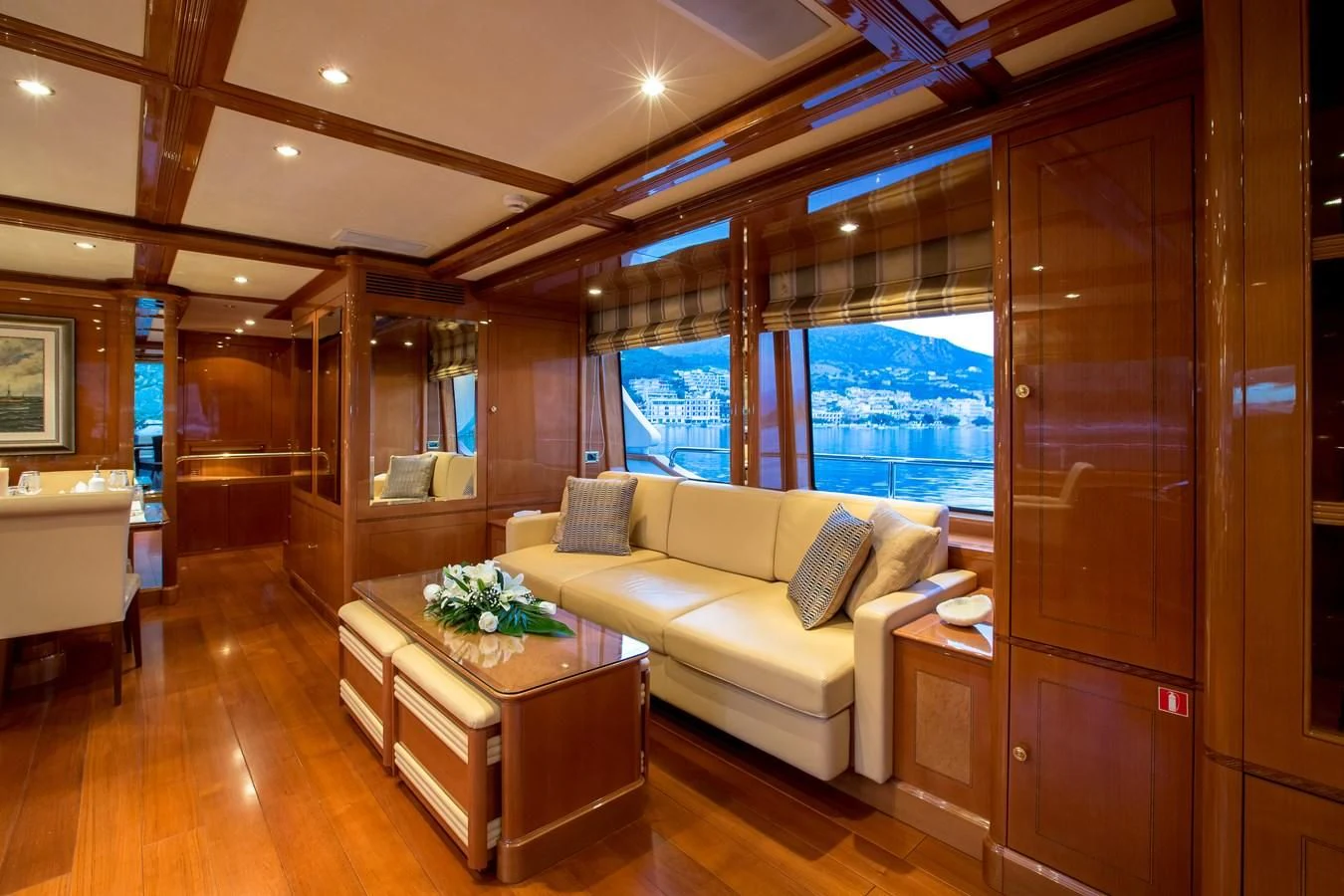 a living room with a couch and a table aboard REBECCA V Yacht for Sale