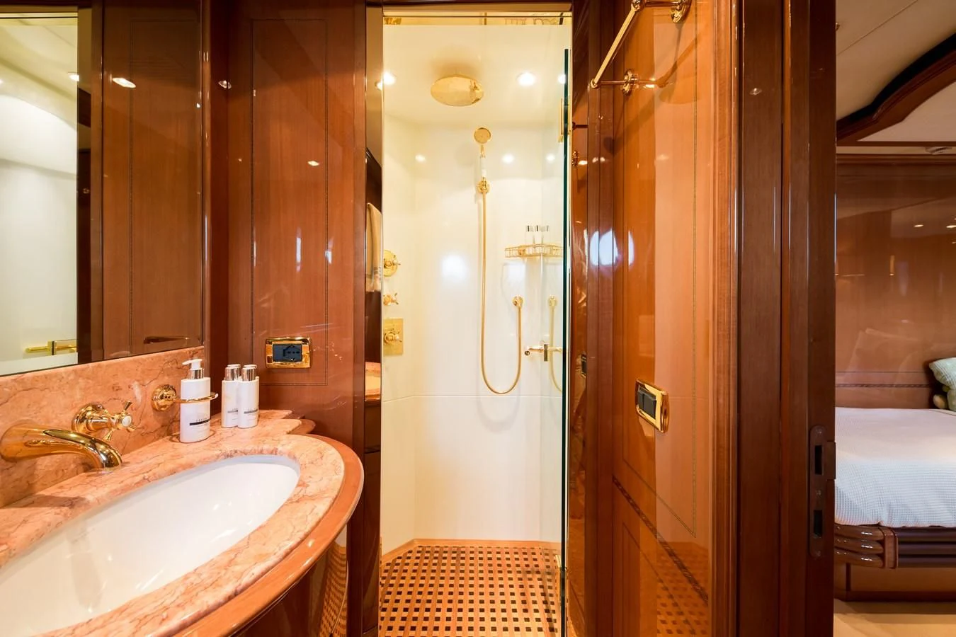 a bathroom with a urinal and sink aboard REBECCA V Yacht for Sale