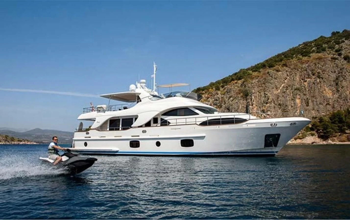 a person on a boat in the water aboard REBECCA V Yacht for Sale