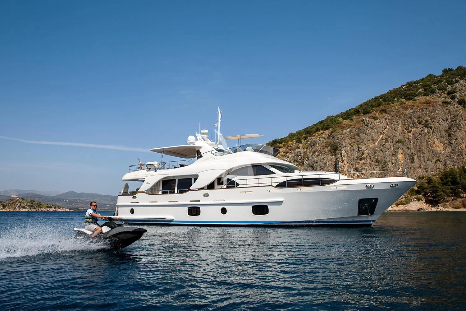 a person on a boat in the water aboard REBECCA V Yacht for Sale