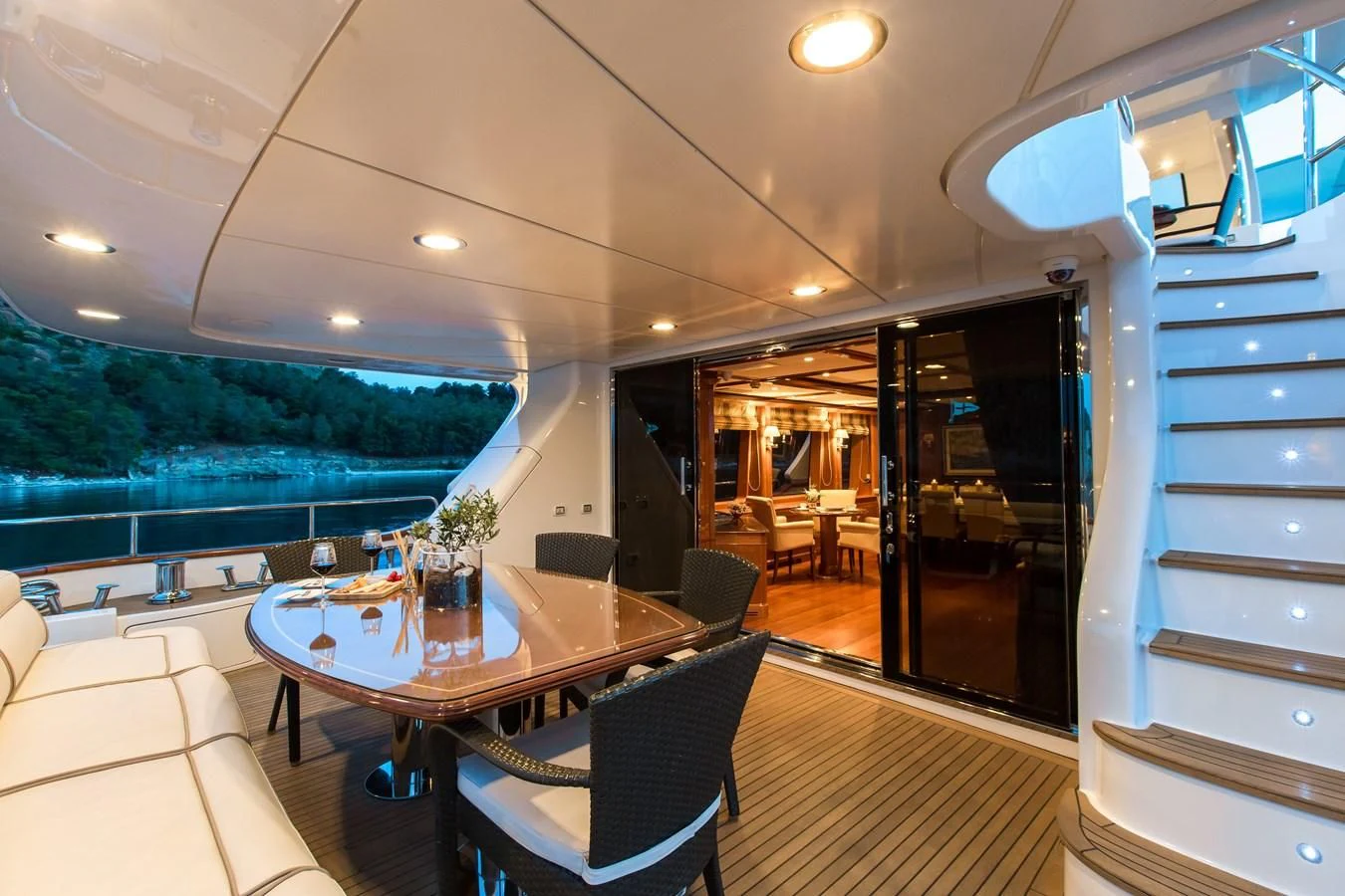 a room with a table and chairs aboard REBECCA V Yacht for Sale