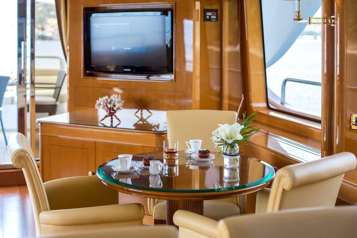 a room with a table and chairs aboard REBECCA V Yacht for Sale