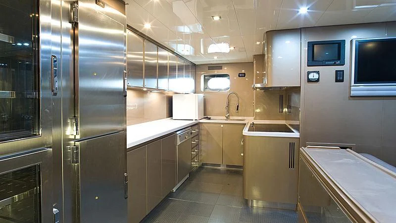 a kitchen with a large refrigerator aboard VITAMIN SEA I Yacht for Sale