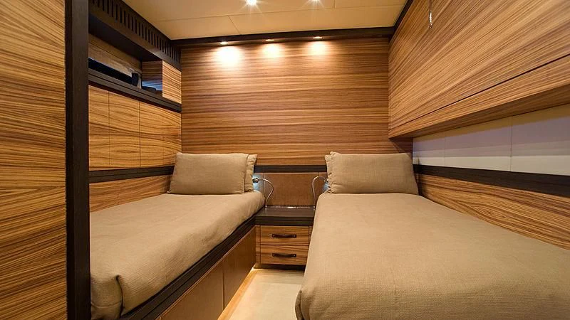 a room with a bed and a couch aboard VITAMIN SEA I Yacht for Sale