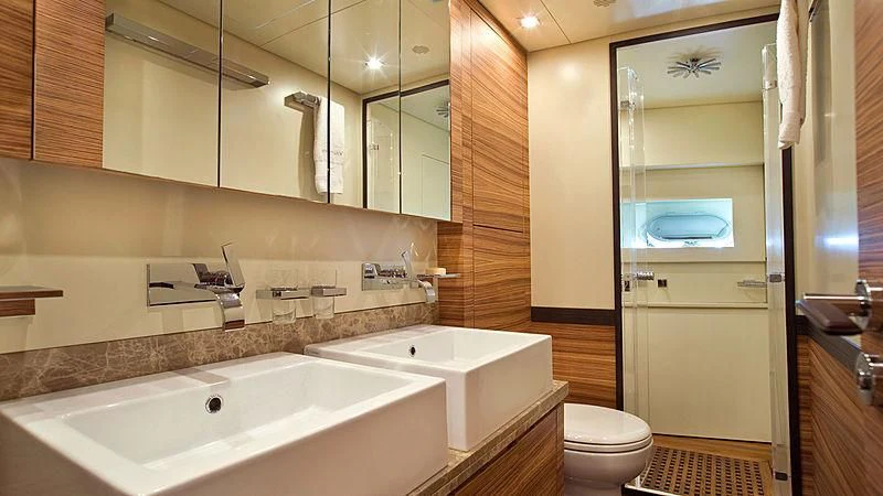 a bathroom with a glass shower door aboard VITAMIN SEA I Yacht for Sale